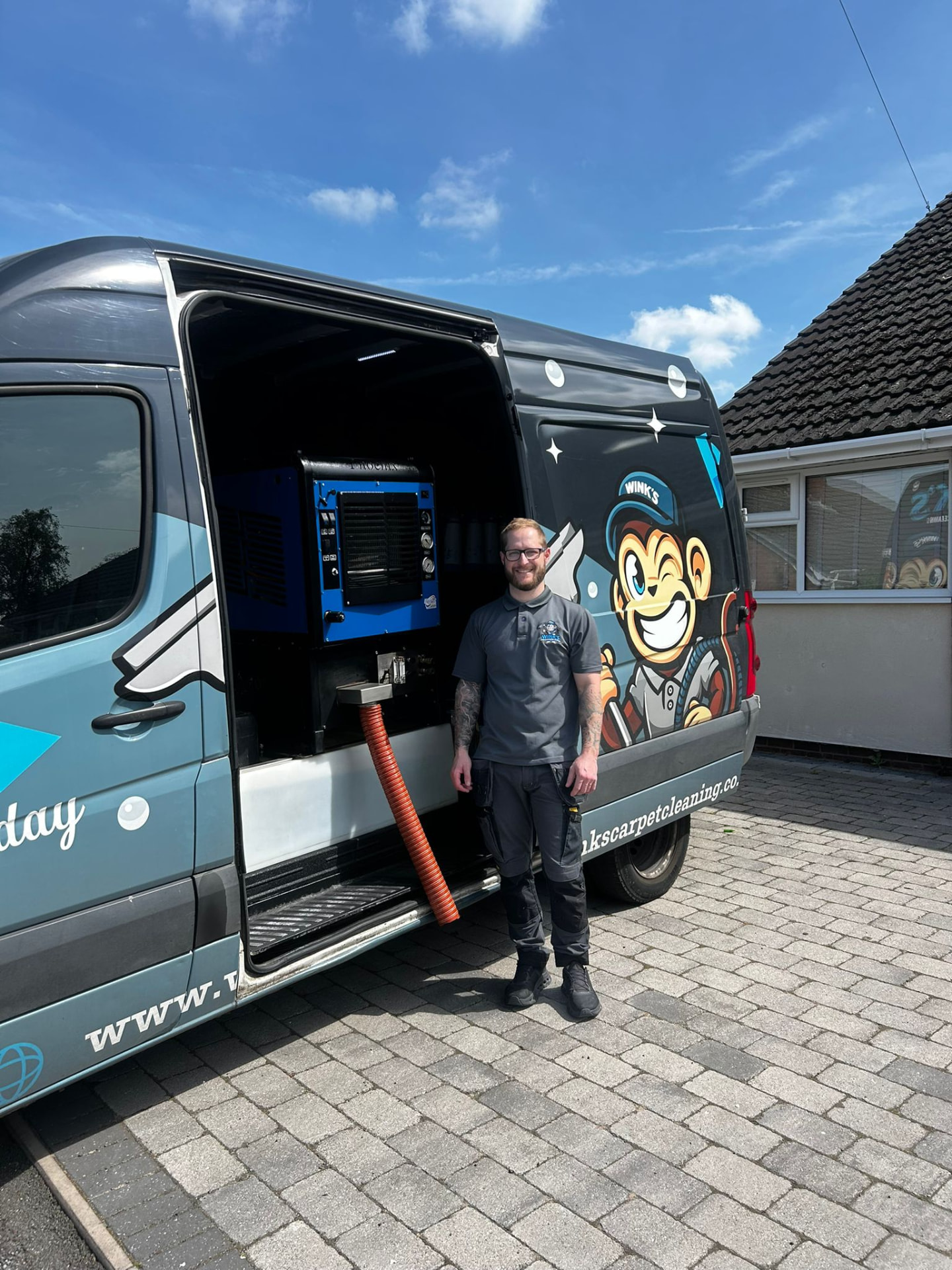 Jack Winkle standing beside his Phoenix 570i truck-mounted carpet cleaning machine in the Wink’s van