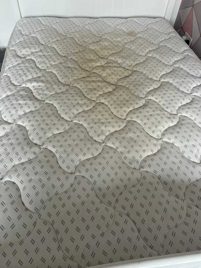 Discoloured mattress restored in Stafford, before professional cleaning