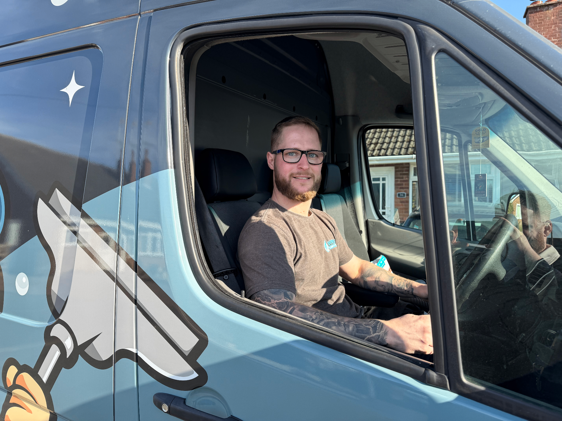 Jack Winkle from Wink's sitting in the company van