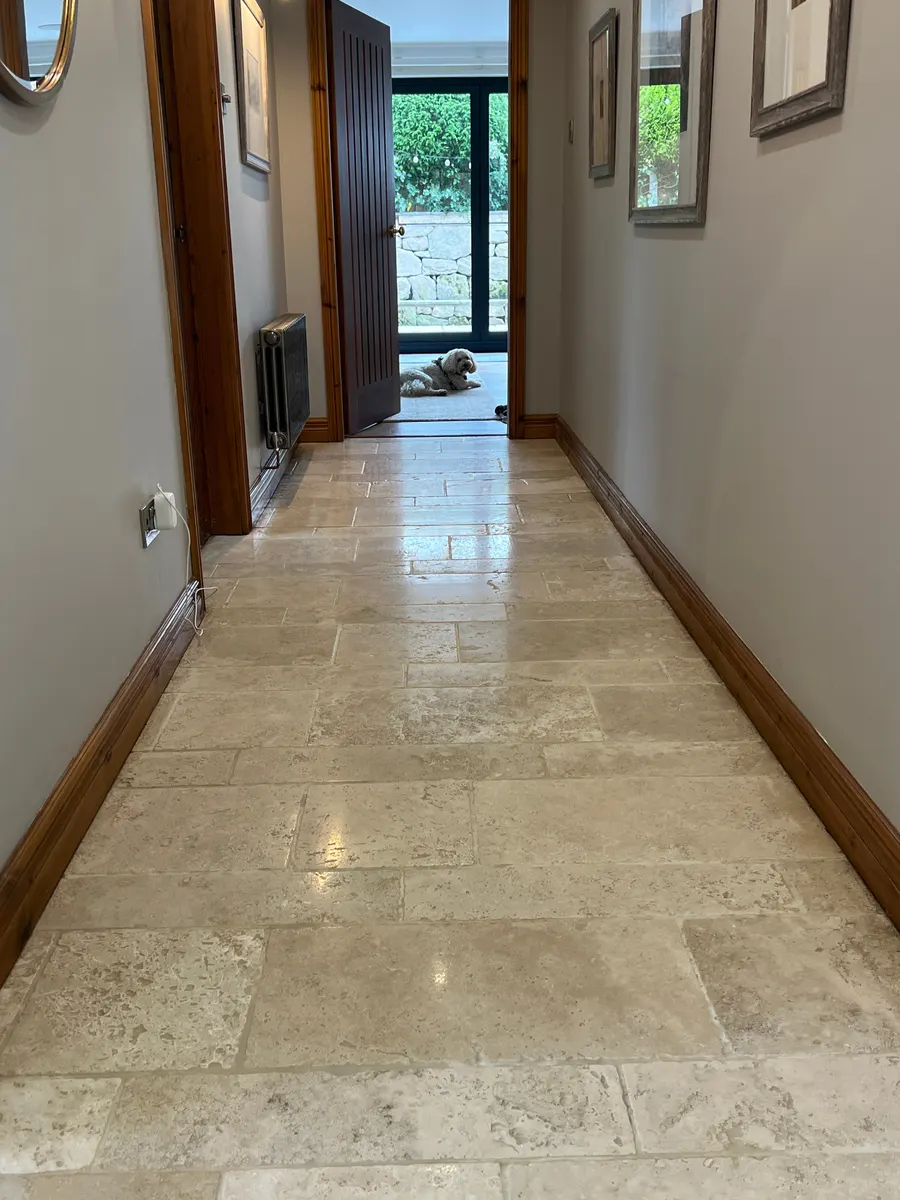 Polished natural stone hallway floor cleaned in Stafford, before professional cleaning